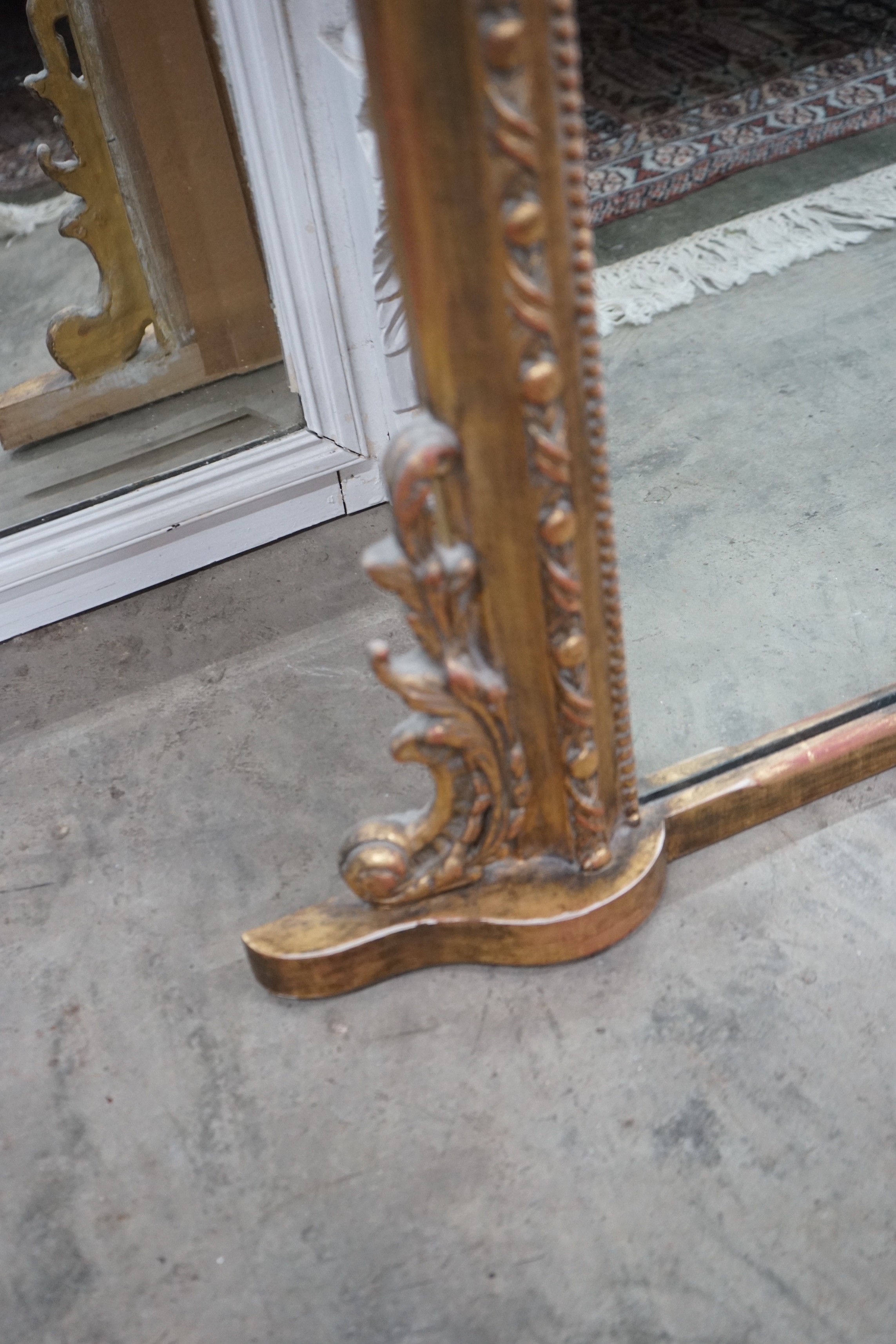 A Victorian style giltwood and composition overmantel mirror, width 136cms, height 138cms.